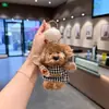 Adorable sombrero de chef estilo coreano, colgante de peluche de cachorro, delantal a rayas, llavero de perro de peluche, amuleto para bolso femenino