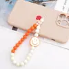 Cadena para teléfono móvil con cuentas acrílicas, moderna y con diseño de emoticono, colgante resistente a caídas para mujer