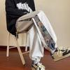 Pantalones casuales para hombre transfronterizos holgados de marca de moda estampados pantalones largos para hombre juventud estilo Hong Kong modernos versátiles con puño en el tobillo pantalones estilo nacional