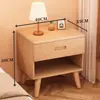 Mesita de noche de madera maciza para dormitorio del hogar 2026 Venta caliente Creativa Pequeño Armario de almacenamiento simple para niños Mesita de noche de tronco