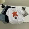 Camiseta Branca de Algodão Puro com Gola Redonda e Estampa de Estrelas Estilo Coreano para Mulheres Verão Solta e Versátil Emagrecedora Simples Casual