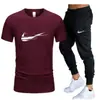 Traje casual de color liso para hombre de verano transfronterizo 2024 Camiseta de algodón de cuello redondo + Pantalones Moda Dos piezas
