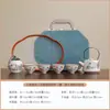 Juego de té de viaje estilo bolso de mano de la cerámica Ru con esmalte de ceniza vegetal, una tetera y cuatro tazas, tetera, gaiwan, taza de degustación de té, juego de tetera con asa