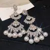 Pendientes de botón de plata con forma de corazón y circonita de estilo europeo y americano, pendientes de borla estilo palacio, pendientes exagerados de lujo ligero de alta gama al por mayor