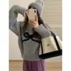 Suéter de punto con cuello redondo y lazo lindo de cachemira para mujer, nuevo para otoño, top interior de punto suelto y corto