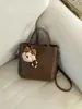 Bolso de Cubo de Estilo Coreano de Nicho Transfronterizo para Mujer Primavera 2026 Nuevo Bolso de Hombro Cruzado Casual Elegante de Gama Alta