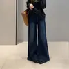 Nova coleção de outono Zedaijiai: jeans casual estilo Hong Kong retrô, elástico, modelador, cintura alta, com design de cinto, levemente flare, para mulheres