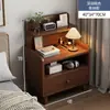 Mesita de noche moderna simple con patas de madera maciza, pequeño armario de almacenamiento para uso en el dormitorio, estante de noche modelo nuevo 2025