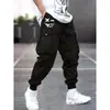 Nuevos pantalones cargo para hombre de comercio exterior transfronterizo para primavera y otoño, multibolsillos, cintura elástica con cordón, estilo jogger, venta al por mayor y dropshipping