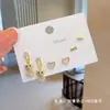Pendientes pequeños de una semana, populares pendientes pequeños de aguja de plata S925, una tarjeta, tres pares de pendientes de combinación de traje, pendientes de circonita roja de red para mujer