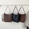Bolso tipo cubo de cuero PU de gran capacidad minimalista estilo coreano, un artículo de moda transfronterizo de alta gama y único, perfecto para ir al trabajo y el uso diario, un bolso de hombro tote para mujer