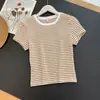 Venta al por mayor transfronteriza Ropa de mujer europea y americana Verano Nueva moda Simple Casual Cuello redondo Manga corta Corte ajustado Top 4744101