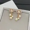 Pendientes Redondos de Perla Nuevos de la Marca Dior/Dior Pendientes Tachonados con Diamantes Letra Cd Moda Europea y Americana Pendientes Versátiles para Mujer Venta al por Mayor