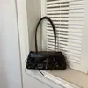 Bolso de axila de moda de nicho para mujer de gran capacidad, nuevo modelo de principios de otoño de 2026, alto valor estético, bolso cuadrado pequeño de un solo hombro de color sólido