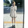 Nuevo conjunto de estilo coreano, un look suave y relajado, extremadamente elegante, conjunto de dos piezas de cárdigan de punto y falda corta