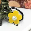 Diadema popular de temperamento estilo coreano 2017 tienda de 2 yuanes joyería dulce color sólido bola de diamante flor de tela banda de goma cuerda para la cabeza