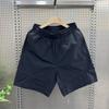 Shorts casuales delgados de verano de secado rápido de cinco puntos para hombre, shorts sueltos modernos de color sólido, shorts juveniles con cordón para playa al aire libre