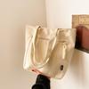 Bolso de Hombro Simple de Color Sólido 2024 Nuevo Bolso Tote Ligero y Moderno de Gran Capacidad Popular Nicho Hermoso Bolso de Lona