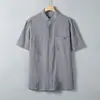 Camisa de manga corta para hombre, nueva tendencia de verano 2025, camisa de lino y algodón de media manga, cuello alto, informal