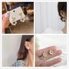 2022 nuevos aretes simples pequeños frescos personalizados dulces pétalos irregulares aretes de borla aretes aretes para mujer
