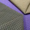 Tejido de cuadros moderno e impermeable con tejido jacquard, adecuado para chaquetas, pantalones de plumas y vestidos; tela ligeramente texturizada