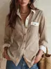 2026 Estilo Europeo Raya Vertical Bloque de Color Cuello Blanco Hebilla Dorada Manga Larga Solapa Bolsillo Único Viaje Camisa Ligera para Mujer