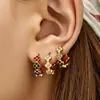 Pendientes de moda de nicho de alta gama estilo ins, pendientes de flor de cuatro hojas con circonita de acero inoxidable chapado en oro que conserva el color para mujer