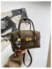 Bolso de mano Boston de gamuza vintage transfronterizo para mujer, nuevo bolso nicho de alta moda tipo almohada, bolso de hombro y bandolera