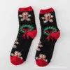 Calcetines de terciopelo coral para mujer otoño e invierno engrosados rojo navideño calcetines de medio terciopelo adulto para casa piso para dormir