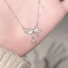 Colar Gargantilha Corrente Clavícula Coração Doce Super Fada para Mulheres, Design de Nicho Ins com Toque de Luxo, Colar Laço com Pedra Olho de Gato para Mulheres