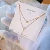 Colar de aço titânio com franja de zircônia de diamante único feminino luxo leve nicho corrente de suéter pingente duplo corrente da clavícula joia nova