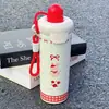 Botella de agua aislada de acero inoxidable 316, diseño elegante y lindo, perfecta para mujeres, con un toque de lujo y un asa portátil