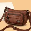 Bolso de mujer con textura de cuero suave, nuevo modelo 2026, simple y elegante, versátil, bolso para mamá, color liso, de hombro cruzado moderno para mujer
