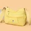 Bolsa de lona de tela Oxford al por mayor para mujer 2026 nueva, moderna, versátil, de hombro cruzada, simple y ligera, bolsa para mamá de mediana edad