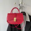 Versión coreana 2026 nueva moda alta calidad elegante versátil simple retro bolso de hombro cruzado bolso tipo silla de montar