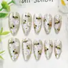 24 PIEZAS Colección de Arte para Uñas Bestseller Transfronterizo Navidad Halloween Flor Uñas Portátiles Ojo de Gato Halloween Piezas de Uñas Portátiles
