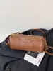 Bolso de mano con patrón tejido retro para mujer, nueva colección de otoño 2026, bolso de hombro versátil para el trabajo, bolso cruzado cilíndrico elegante y con estilo