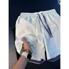 Shorts de secado rápido estilo patchwork americano para hombre, con diseño de bloques de color, un look elegante y deportivo, y corte recto, perfectos para el verano y la playa.