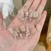 Armadura de mano sentido avanzado hecho a mano ins explosiones diamante roto mariposa uña piezas de uña al por mayor uñas portátiles