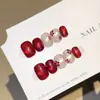 Qianfan Buenas Cosas Florecen Año Nuevo Gato Ojo de Gato Floral Pintado a Mano Uñas Portables Puras Hechas a Mano Blanqueamiento Estilo Corto Puntas de Uñas