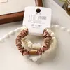 Paquete de 2 Gomas para el Cabello Sencillas Color Café con Lindos Diseños de Animales de Dibujos Animados para Coletas