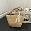 Bolso de Paja Tejida de Verano Transfronterizo 2025 Bolso de Playa para Vacaciones en la Costa Gran Capacidad de Paja Versátil Bolso de Hombro Tipo Cubo