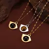 Estilo palacio retro verano temperamento total joyería incrustación geométrica diseño natural piedra ojo de tigre acero de titanio chapado en oro colgante