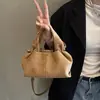 Bolso de gamuza de moda para mujer, nuevo modelo 2026, bolso cruzado versátil para el trabajo, bolso de mano vintage de alta gama, bolso tote pequeño
