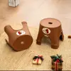 Taburete infantil de plástico engrosado para uso doméstico, taburete bajo apilable para baño, taburete de dibujos animados antideslizante para cambiarse los zapatos, venta al por mayor con impresión de logotipo