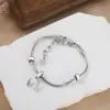 Moda simple transfronteriza para mujer, pulsera de mano, accesorio creativo para auriculares, colgante, pulsera, venta al por mayor, primera generación de pelo