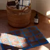 Venta al por mayor de alfombras de moda, de bloques de color, a cuadros y flocadas para exportación, con tufting de alta densidad, tapetes de baño absorbentes y tapetes de entrada antideslizantes
