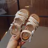 Sandalias para Niñas 2026 Verano Nuevos Zapatos Infantiles Zapatos de Princesa Estilo Coreano Moño Goma Planos Zapatos de Playa para Niños