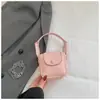Mini Bolso de Color Sólido Estilo Coreano para Mujer 2026 Primavera Nueva Moda Elegante Bolso Silla de Montar Ligero Versátil Bolso para Auriculares