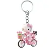 Chaveiro Acrílico Plano 2D Transfronteiriço com Hello Kitty Andando de Moto, Chaveiro Prático, Bonito e Inovador